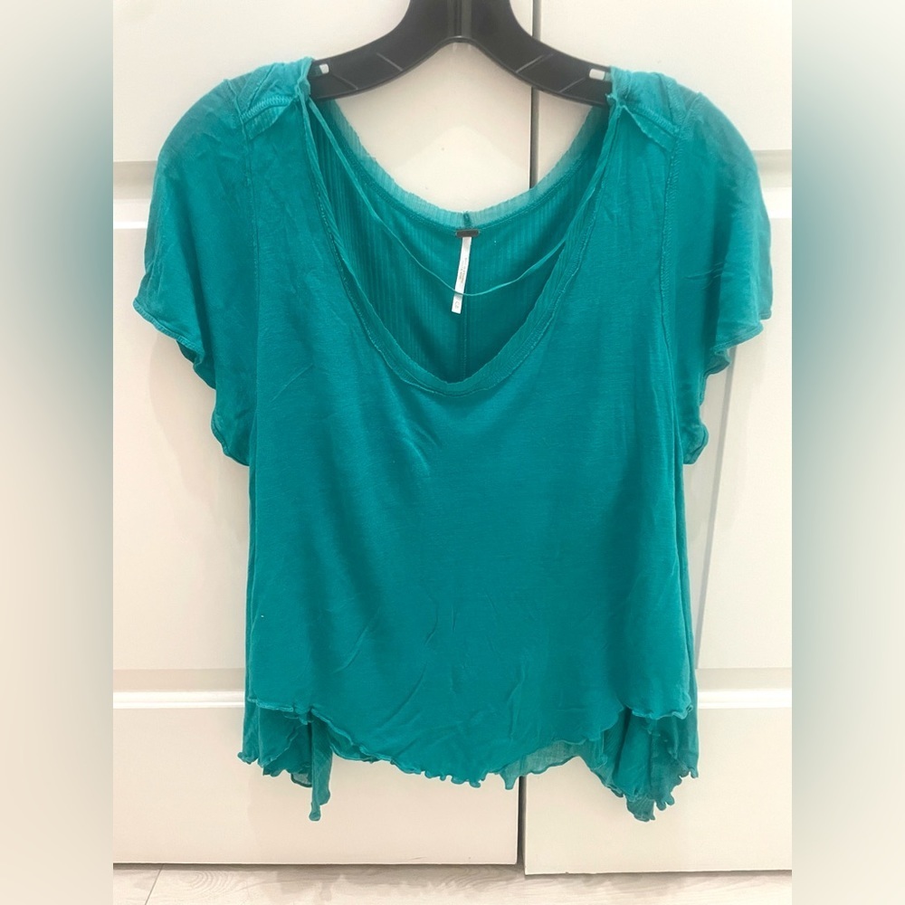 Free People teal layered short sleeve shirt.‎ Size XS.